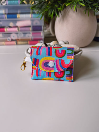 Mini Clip Case Rainbows on Blue - Ana Woods